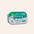 Can of Arctic Char mousse with green label on a beige background