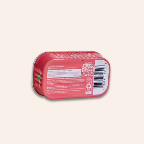 Red can with a label on a light gray background