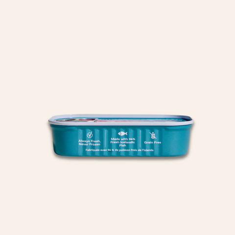 Blue pet food can with text on a beige background