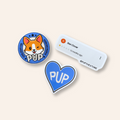Two stickers with 'PUP' branding on a light beige background