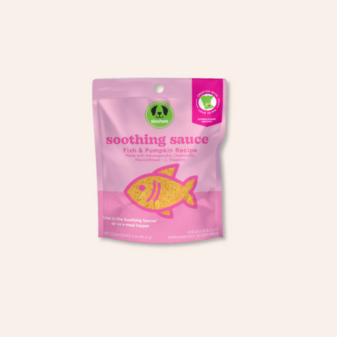 Pink package of 'soothing sauce' with fish illustration on a light pink background