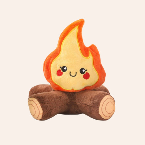 Plush toy shaped like a flame with a smiling face on a white background