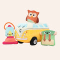 Plush toy van with owl on top, surrounded by other plush toys on a white background