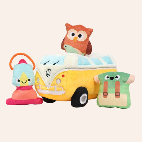 Plush toy van with owl on top, surrounded by other plush toys on a white background