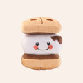 Plush toy resembling a sandwich with a smiling face on a white background