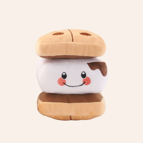 Plush toy resembling a sandwich with a smiling face on a white background