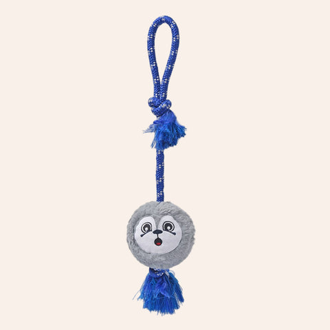 Dog toy with a gray ball and blue rope on a white background