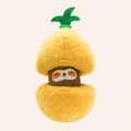 Plush toy shaped like a pineapple with a sloth face on a white background
