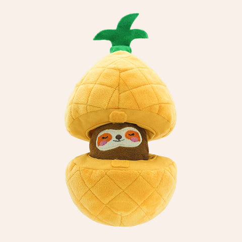 Plush toy shaped like a pineapple with a sloth face on a white background