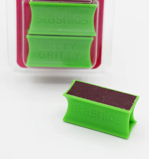 Green sanding block with 'Stashios' branding on a white background
