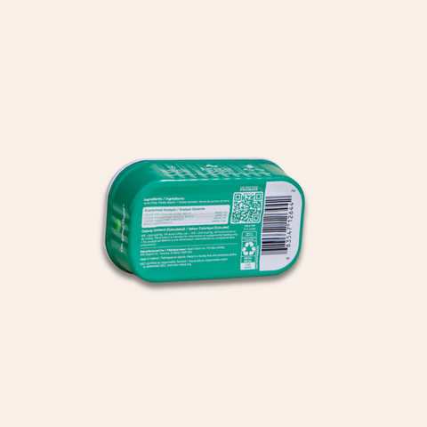 Green rectangular container with label on a light beige background