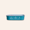 Blue pet food can with text on a beige background