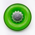 Green bottle cap with a clear center on a white background