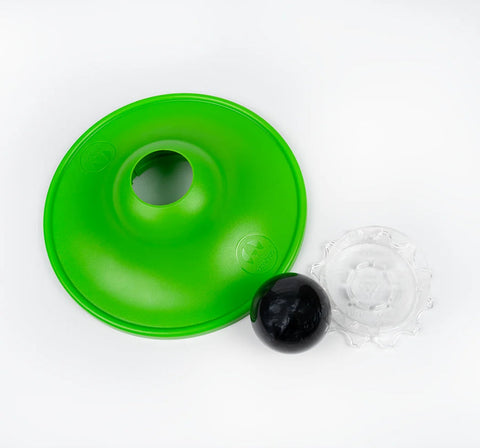 Green plastic funnel-like object with a black ball on a white background