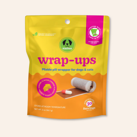 Packaging of 'wrap-ups' pill wrappers for dogs and cats with a yellow and orange design.