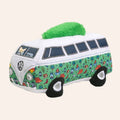 Plush toy shaped like a camper van with a green roof on a white background